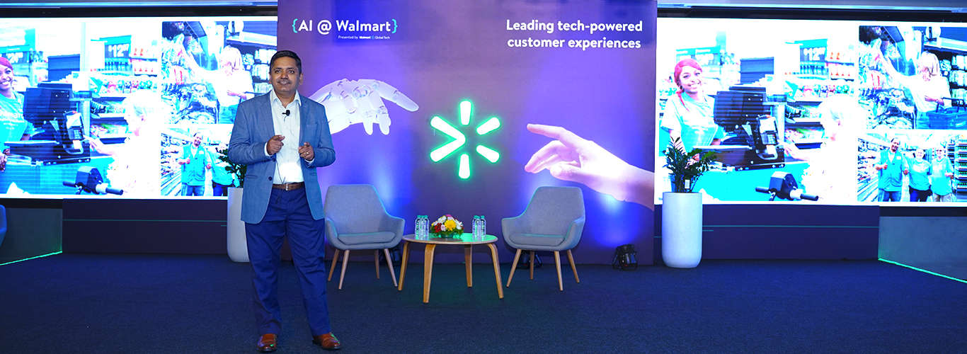 Balu Chaturvedula, SVP & Country Head, Walmart Global Tech standing on stage at AI @ Walmart 2024. 