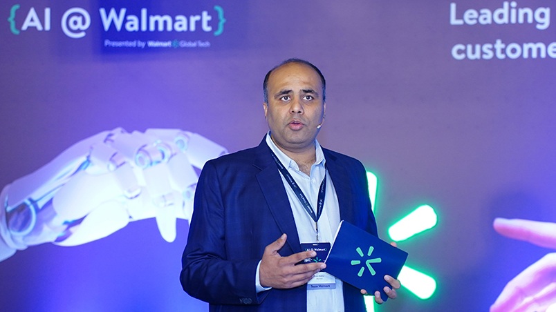 Mohit Mathur, Head of Technology Strategy and Operations, Walmart Global Tech delivering a talk on stage. 