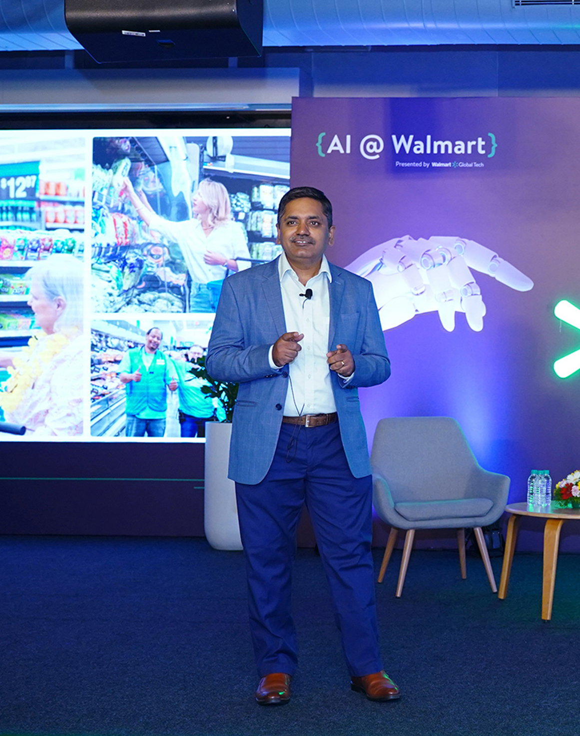 Balu Chaturvedula, SVP & Country Head, Walmart Global Tech standing on stage at AI @ Walmart 2024.
