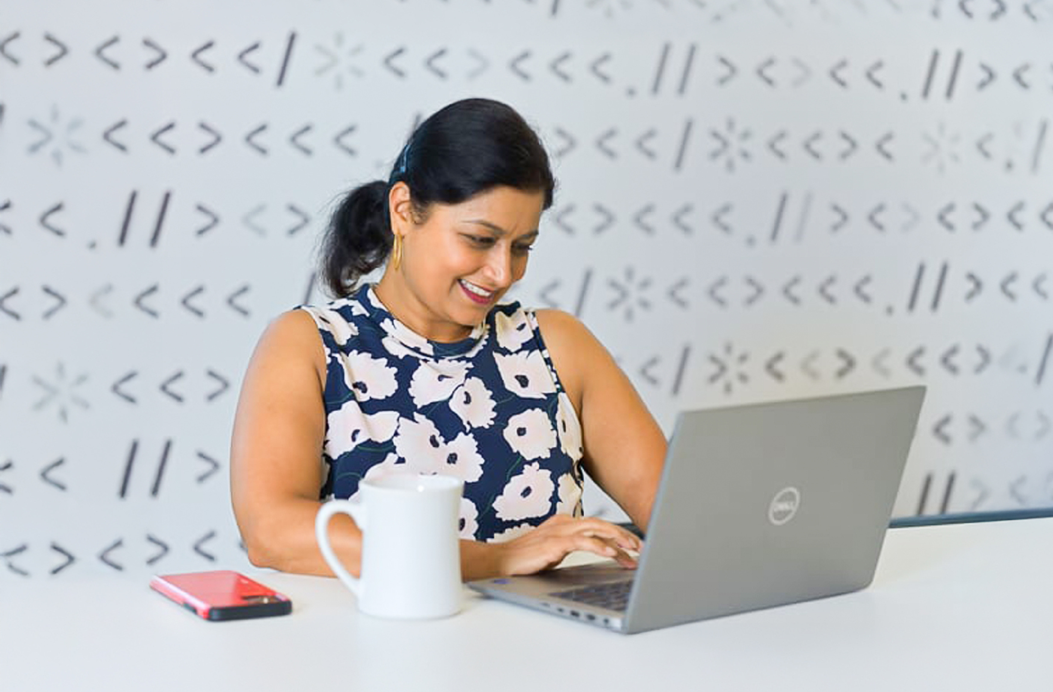 Walmart Global Tech Associate with laptop 