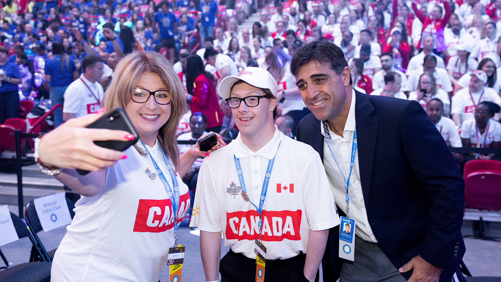 Kevin Pritchard, Special Olympian and Walmart Canada associate smiles with his sister and Gonzalo Gebara at Associates’ Week.