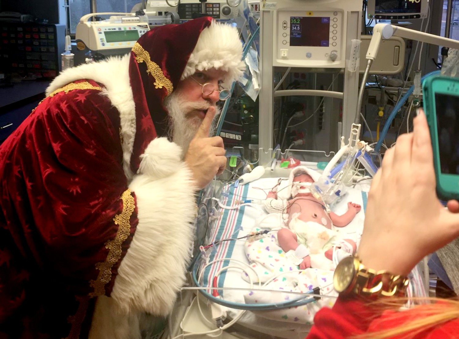 An infant Sloan gets a visit from Santa while in the NICU at Arkansas Children's Hospital.