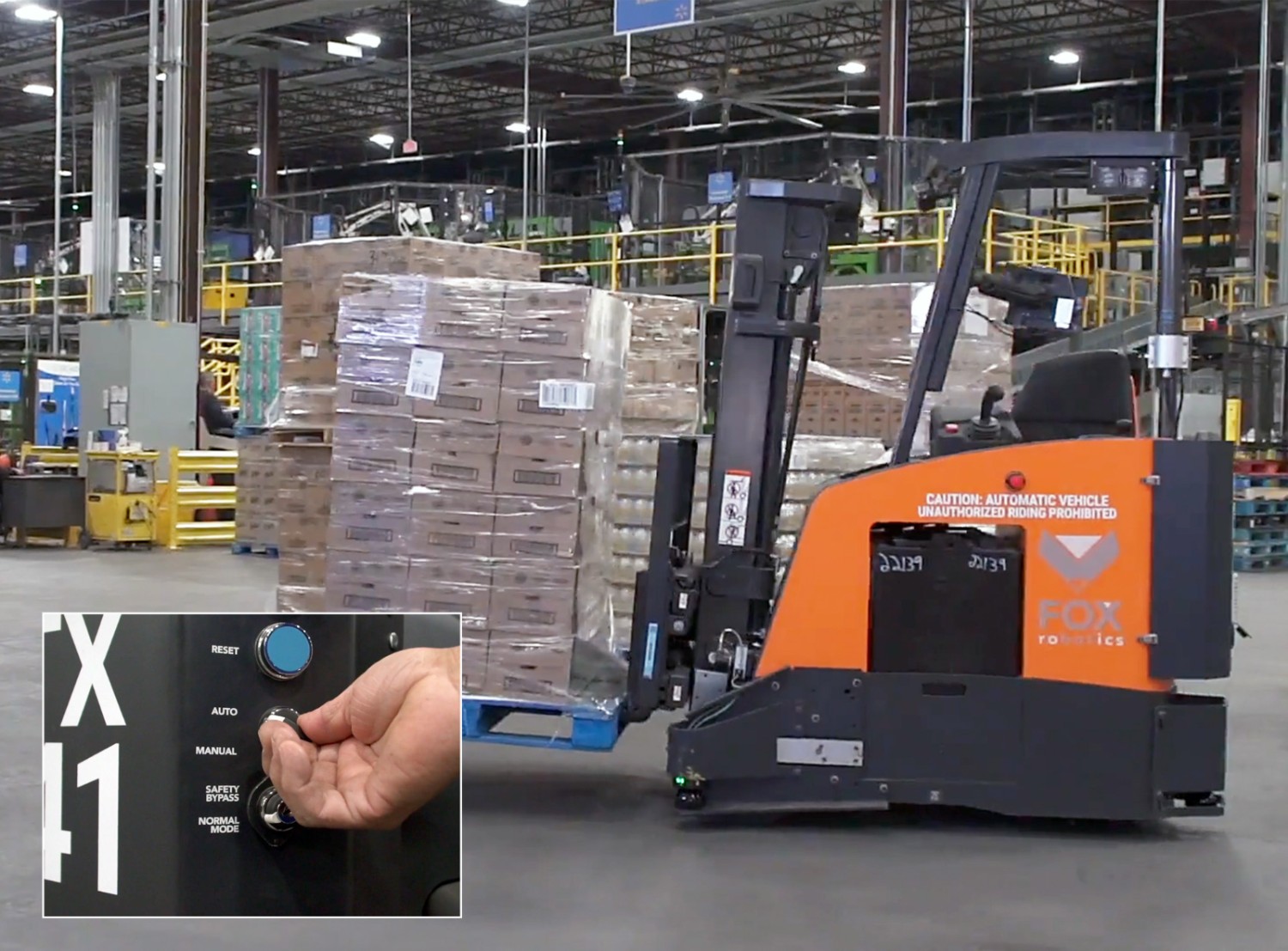 forklift machines at a distribution center surrounded by boxes