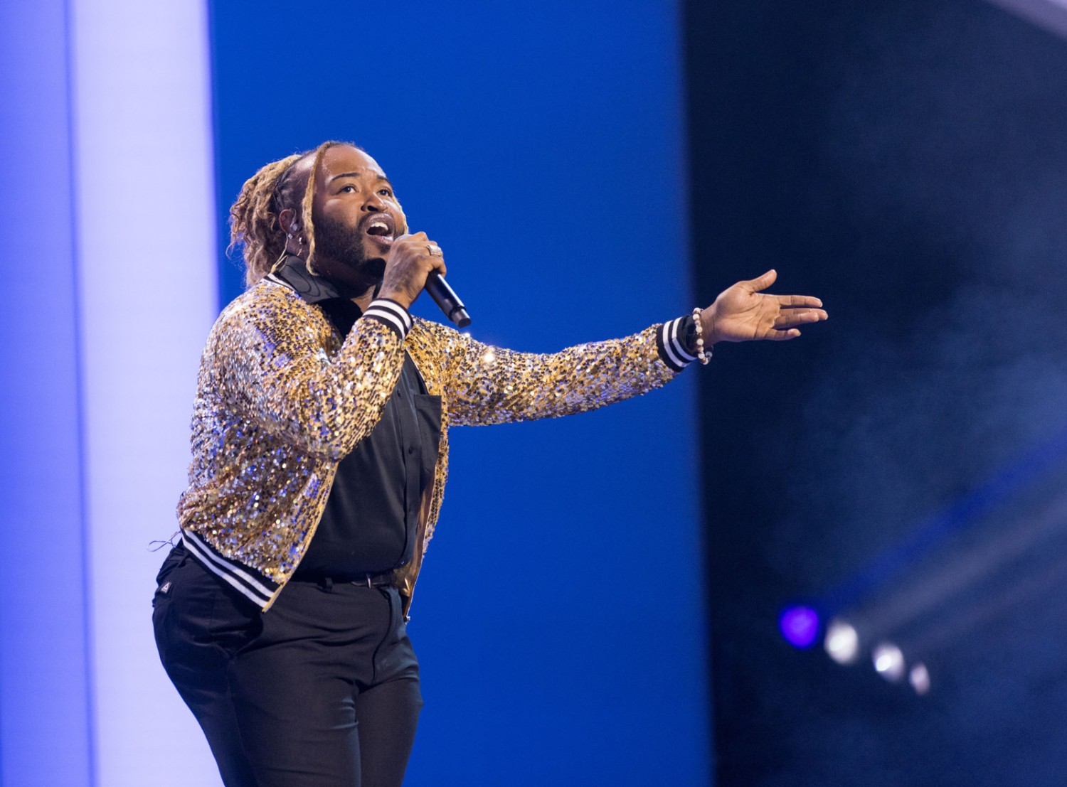 WATs winner singing on stage